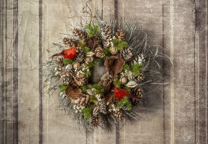 Birch twig wreath with cones, berries, pods, and accented with faux evergreens and feathered birds, delivered