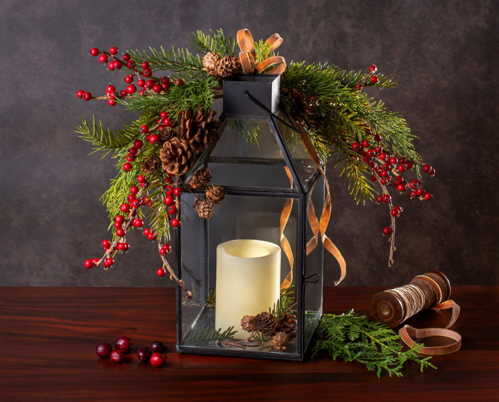 A beautiful glass lantern with festive holiday décor and LED battery powered candle, delivery, Christmas, gifting.